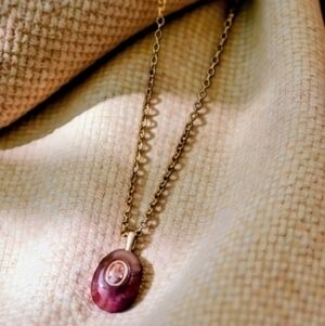 maroon natural stone pendant with embedded zirconia; .78"h x .4"w; nwot